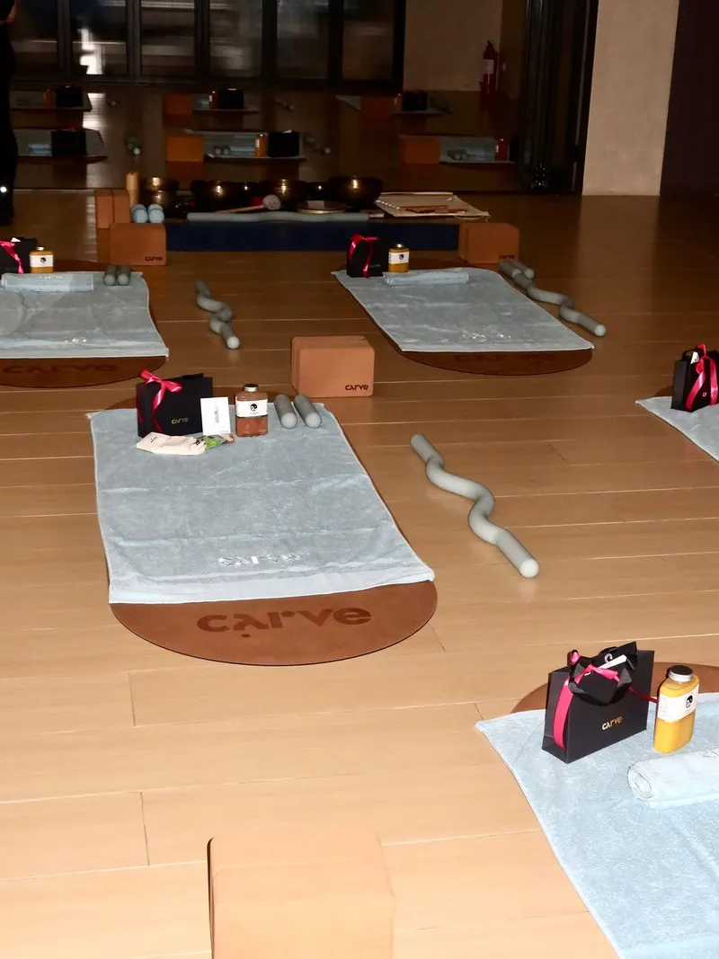 Mats and towels set out on the wooden studio floor at Carve Philippines before a session