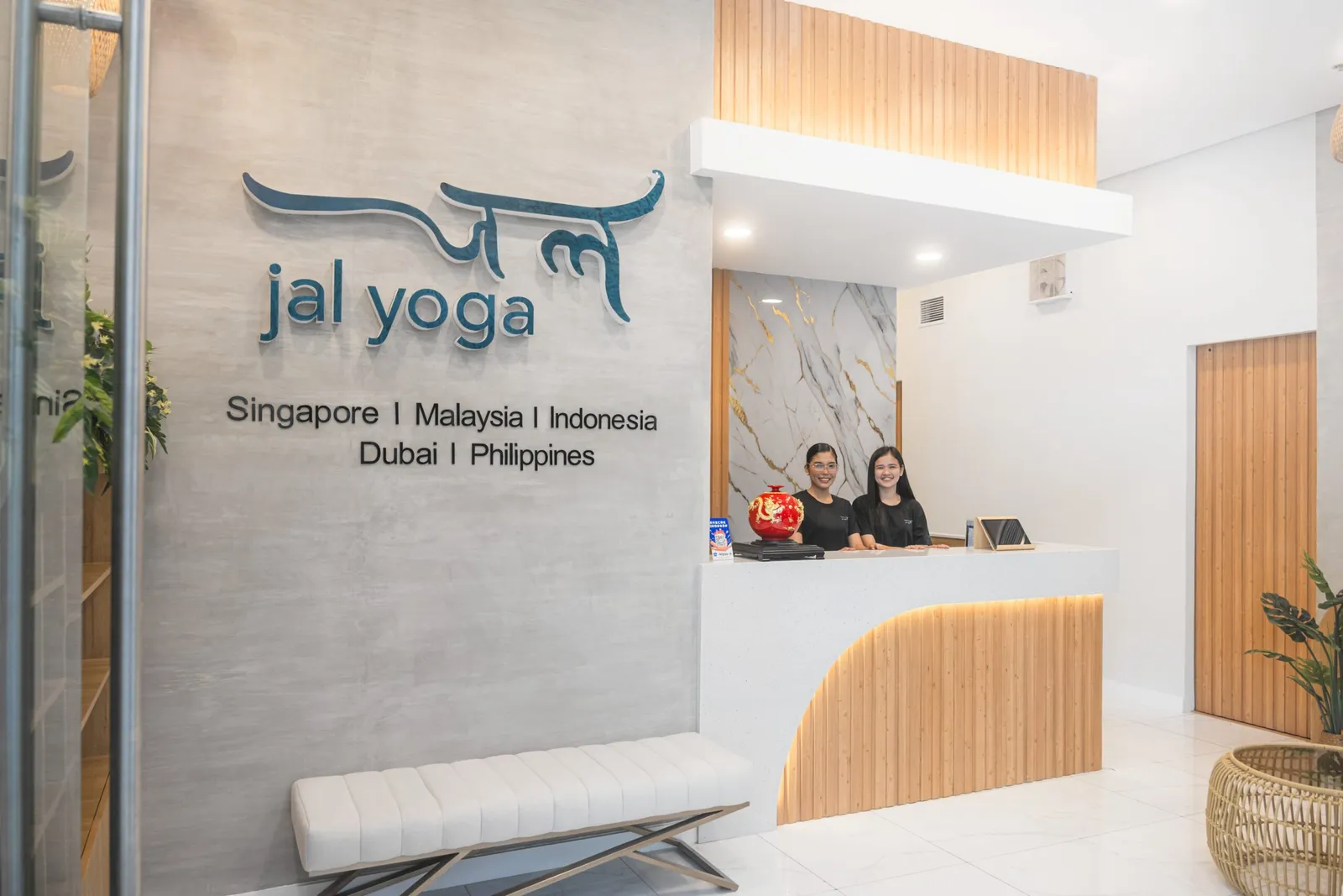 The JAL Yoga reception desk and logo wall