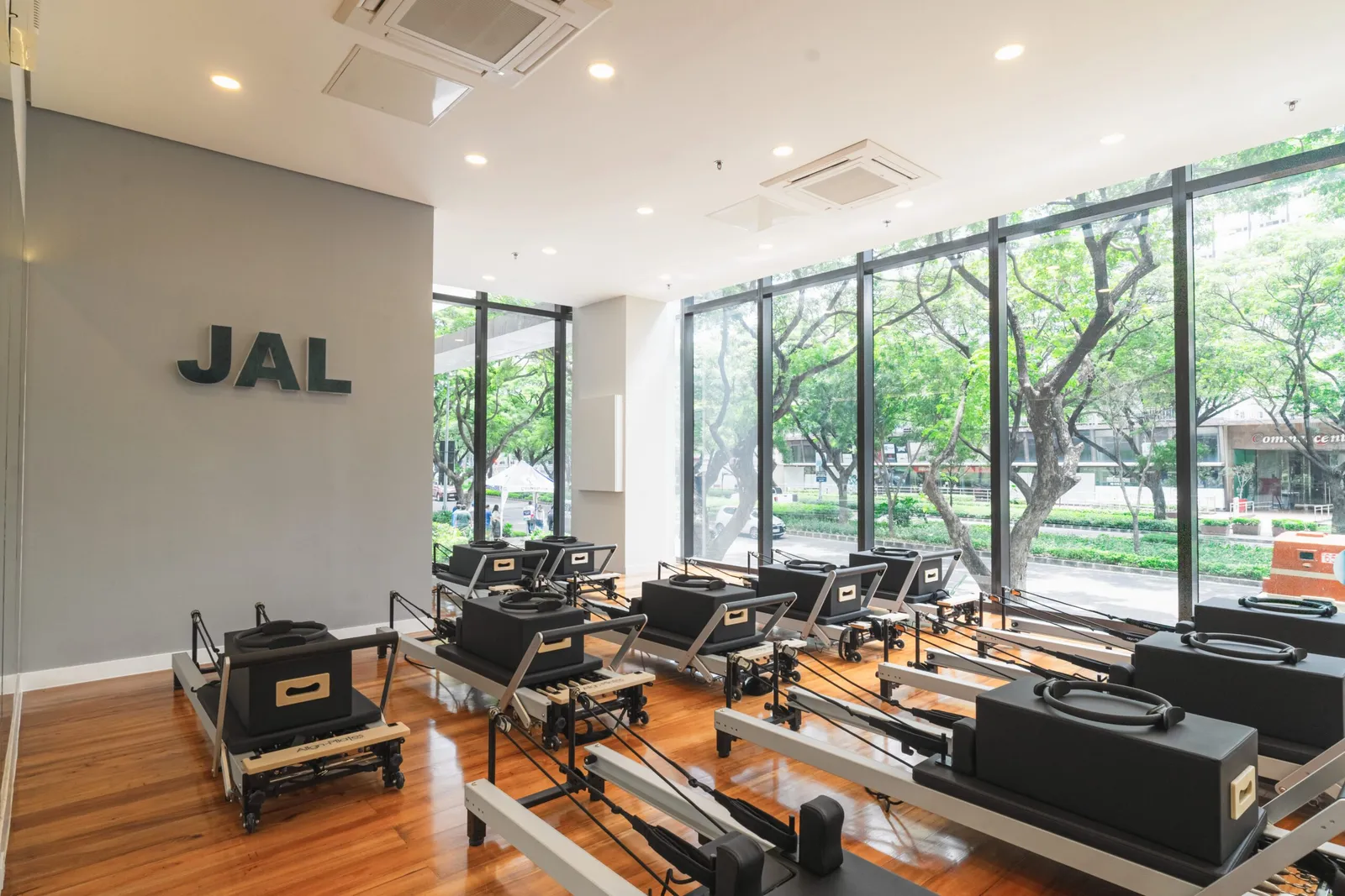 The reformer Pilates room at JAL Yoga with floor-to-ceiling windows
