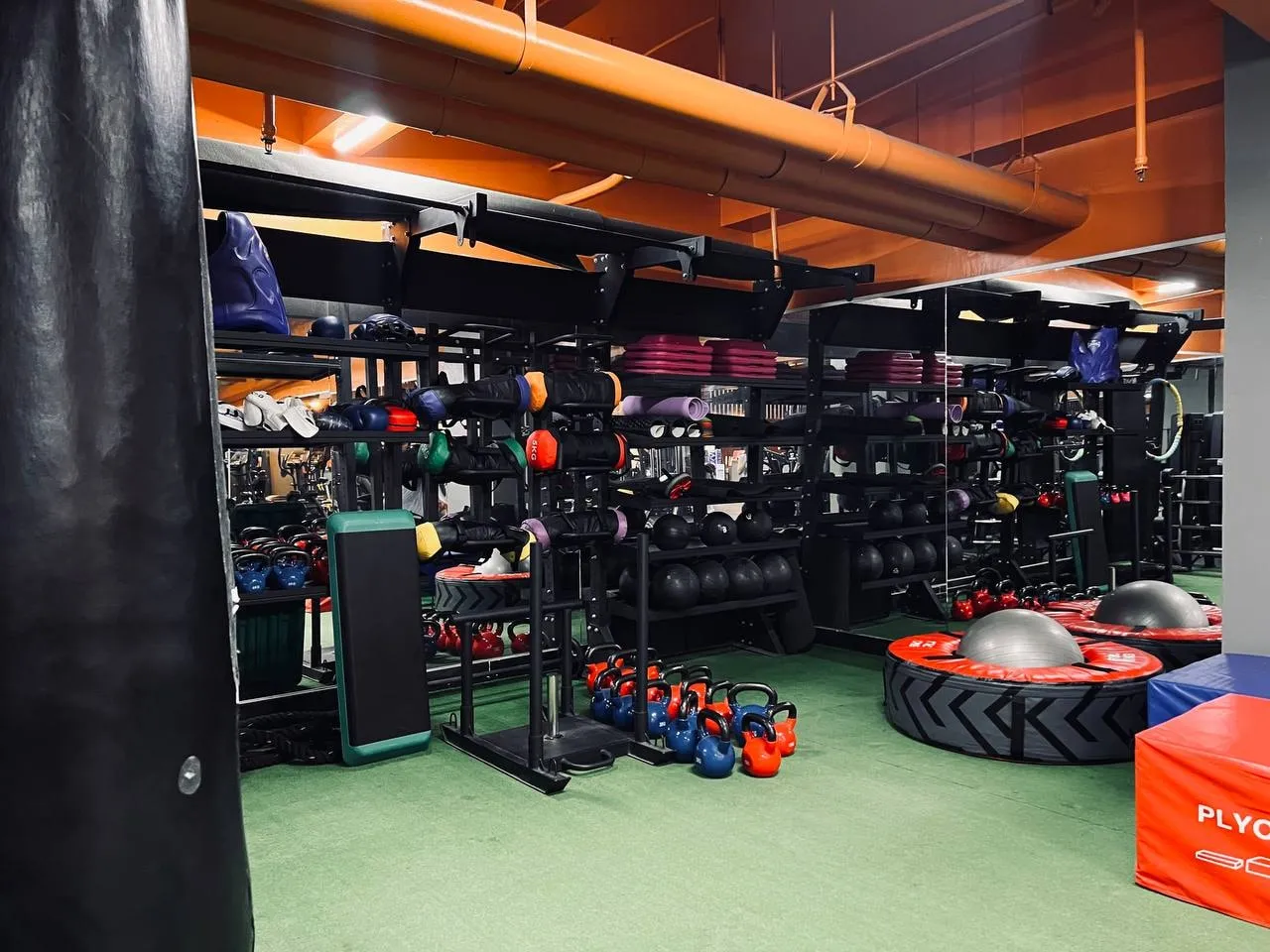 Functional training area with kettlebells, medicine balls and a tyre